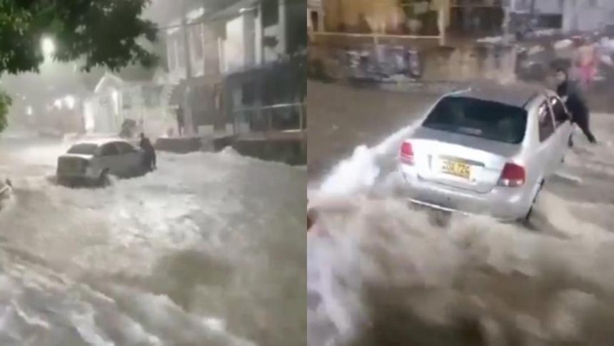 EN VIDEO: Desesperado intentó frenar su carro con sus propias manos mientras era arrastrado por corriente de agua